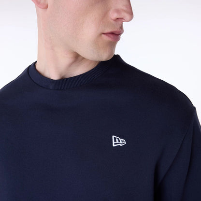 The Male model is wearing New Era Essential Navy Crew Neck Sweater 7