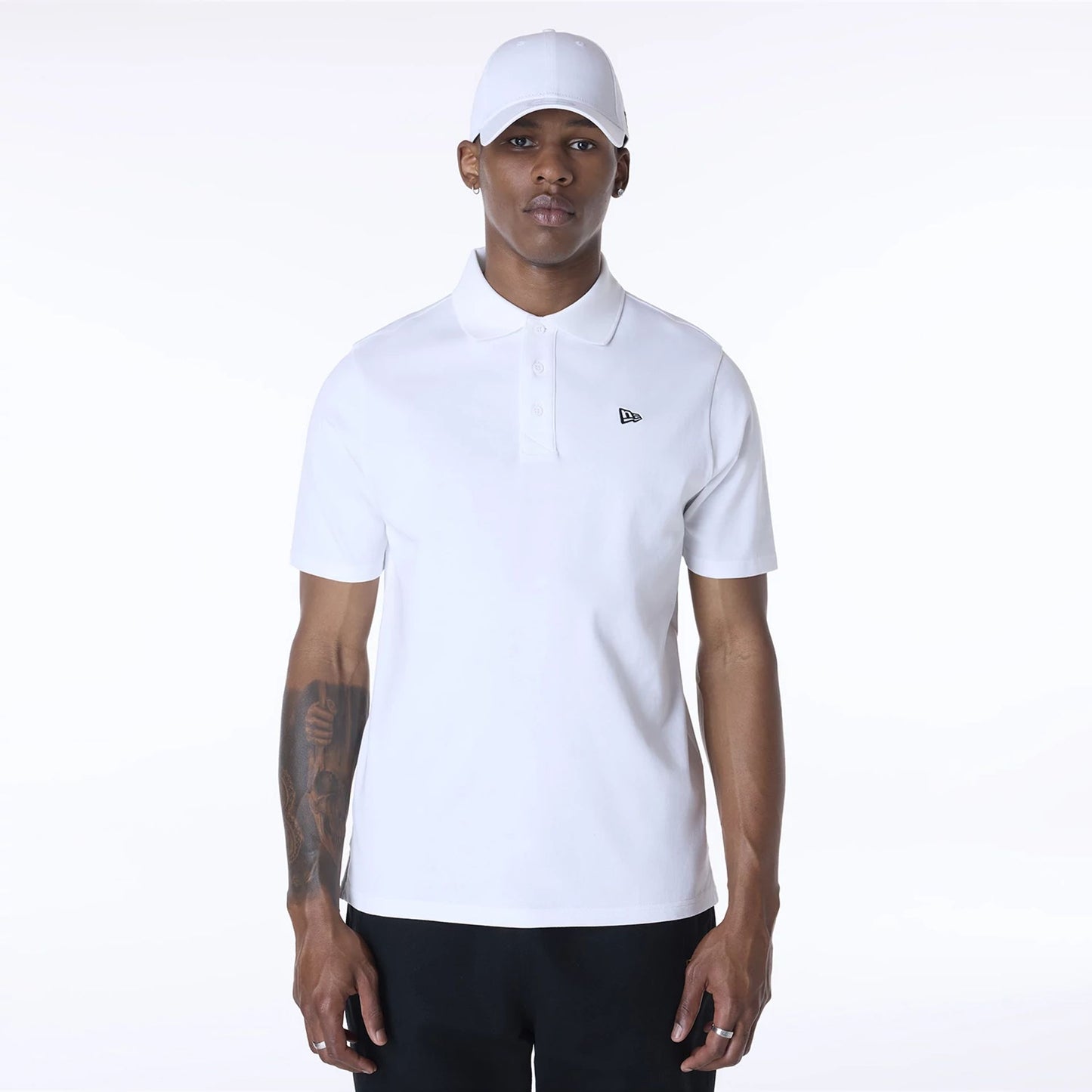 The Male model is wearing New Era Polo White T-Shirt 1