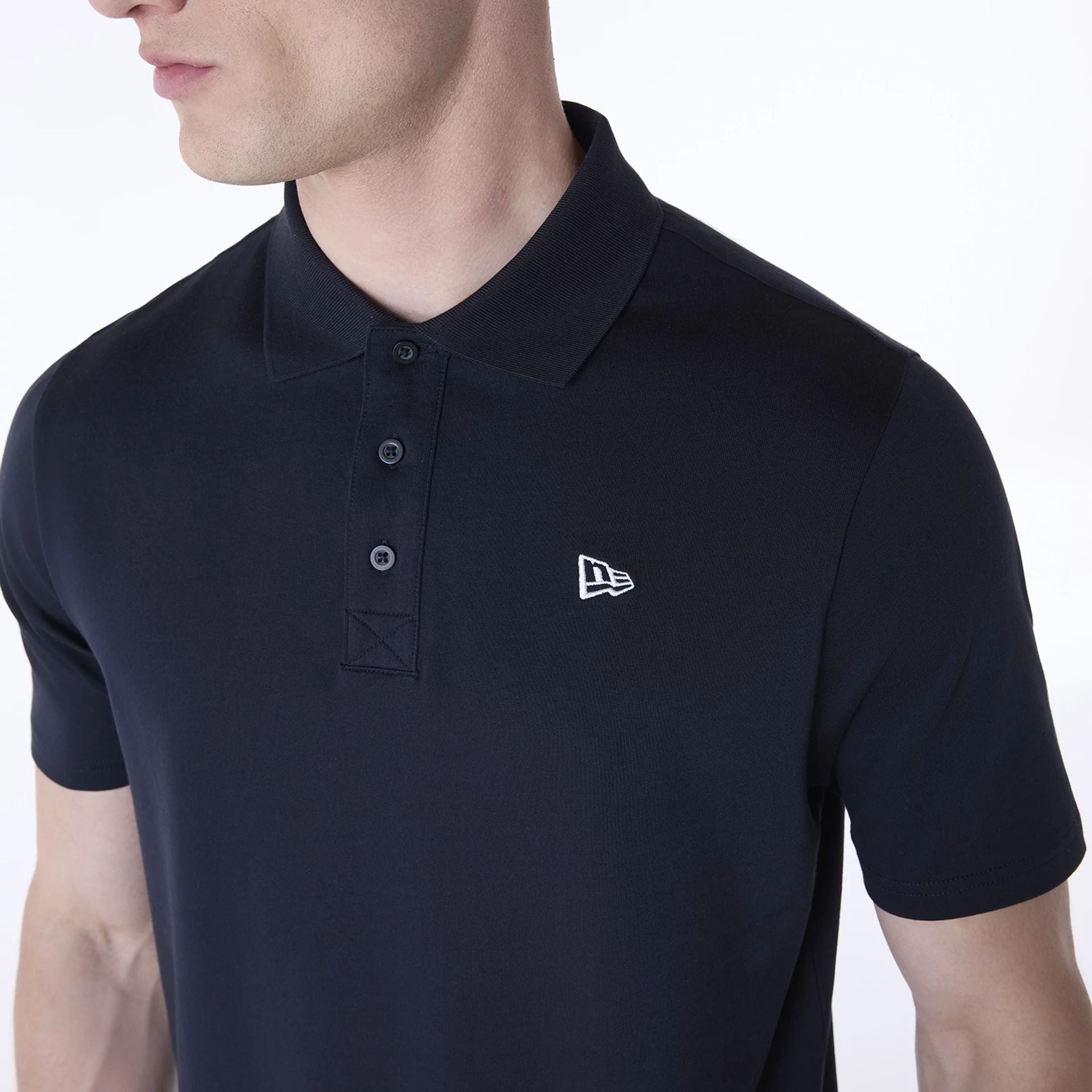 The Male model is wearing New Era Polo Navy T-Shirt 4