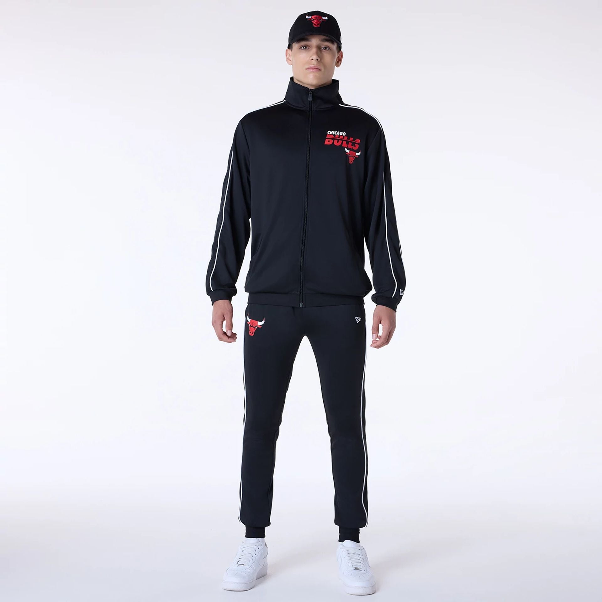 The Male model is wearing Chicago Bulls NBA Poly Track Set Black Track Suit 1