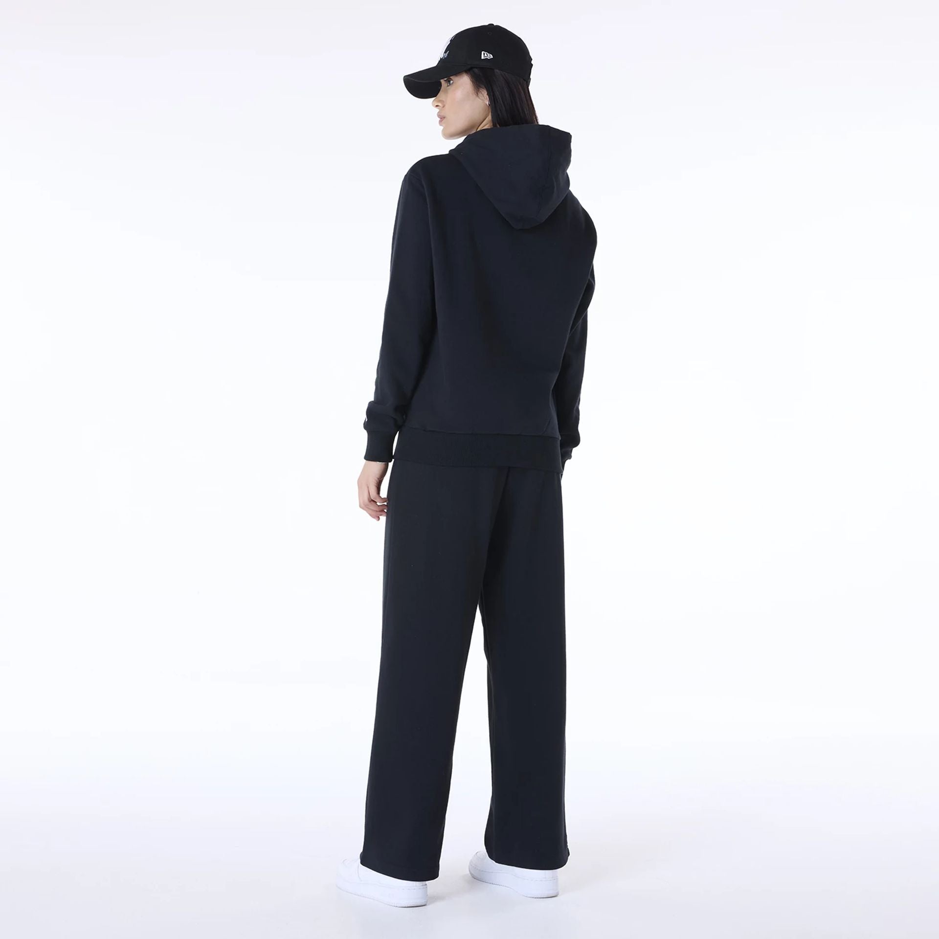 The Female model is wearing New York Yankees MLB League Essential Black Track Suit 2