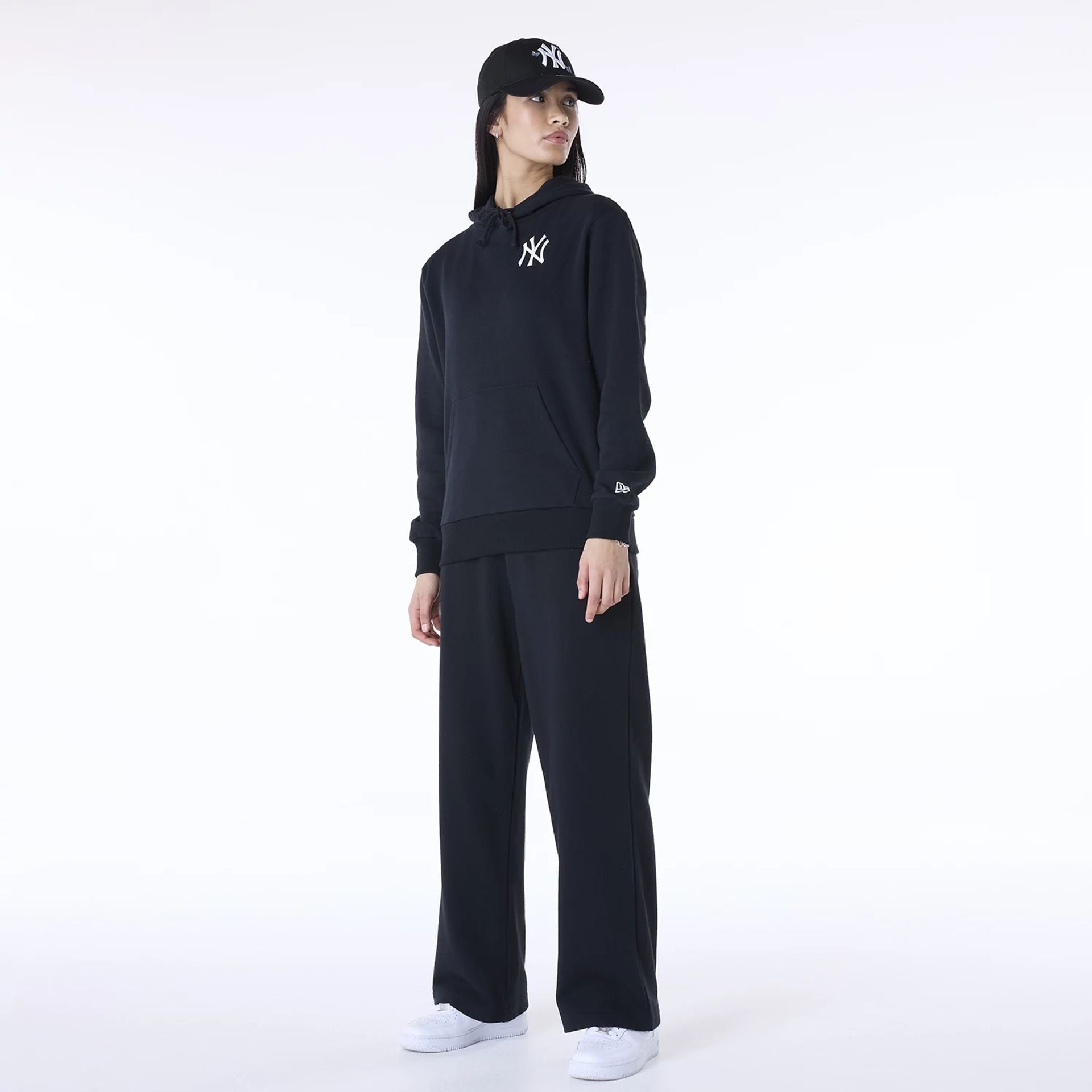 The Female model is wearing New York Yankees MLB League Essential Black Track Suit 4