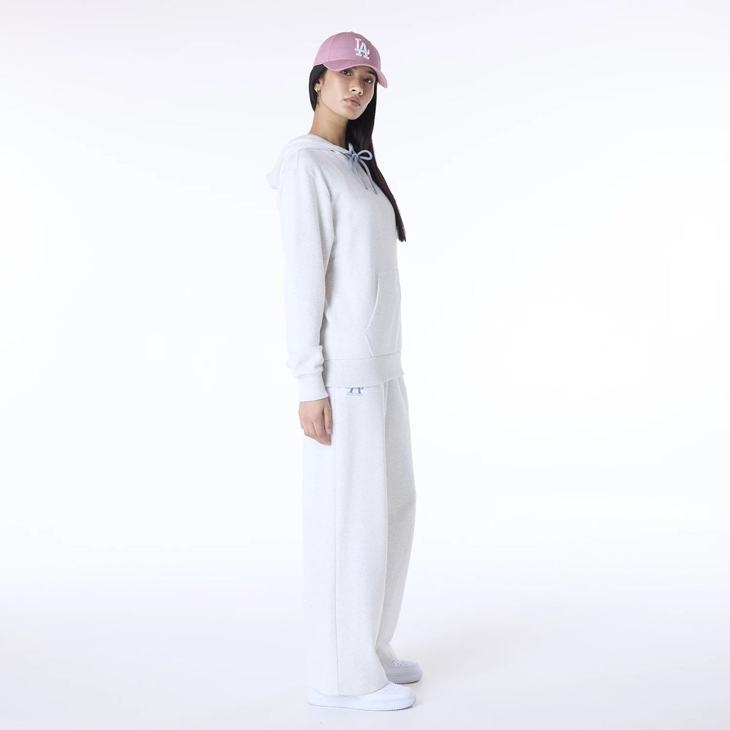 The Female model is wearing LA Dodgers MLB League Essential Pastel Grey Track Suit 3