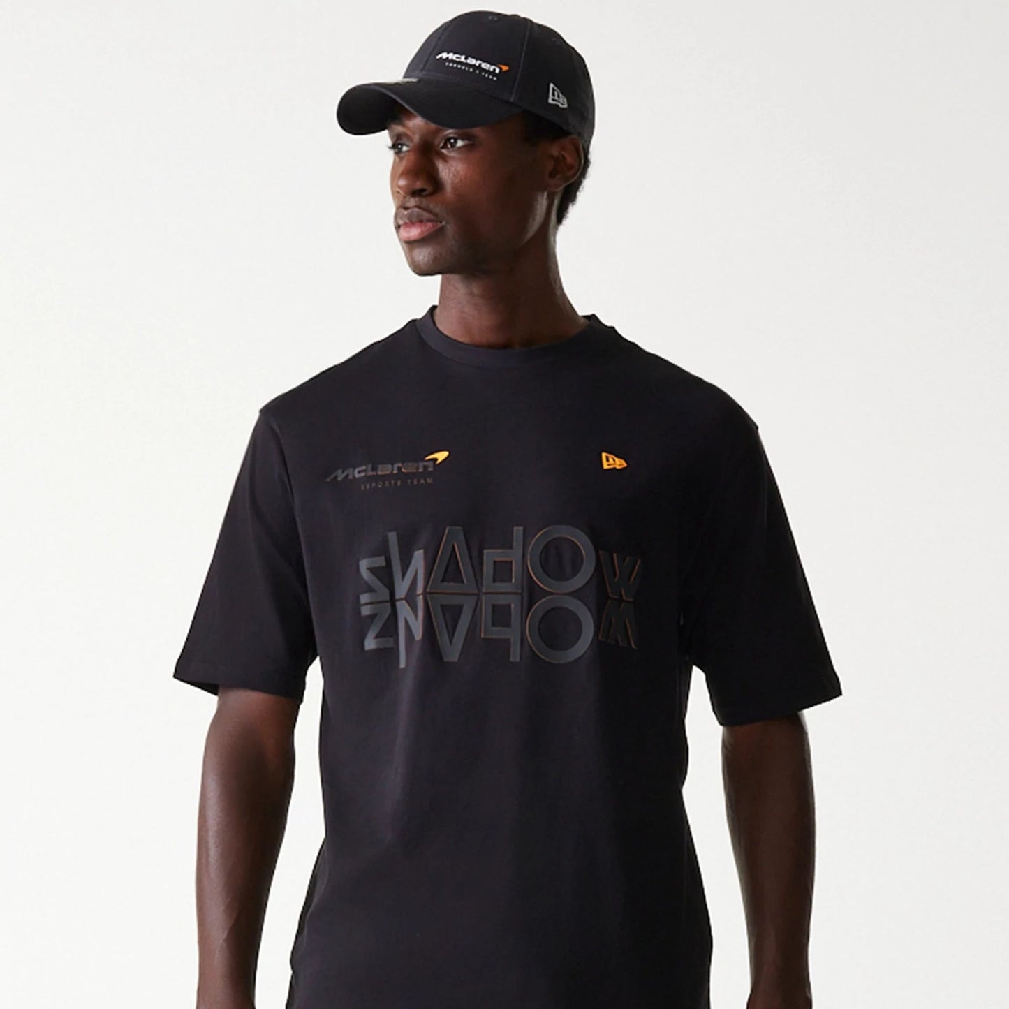 The Male model is wearing McLaren Racing Shadow Black Oversized T-Shirt 3