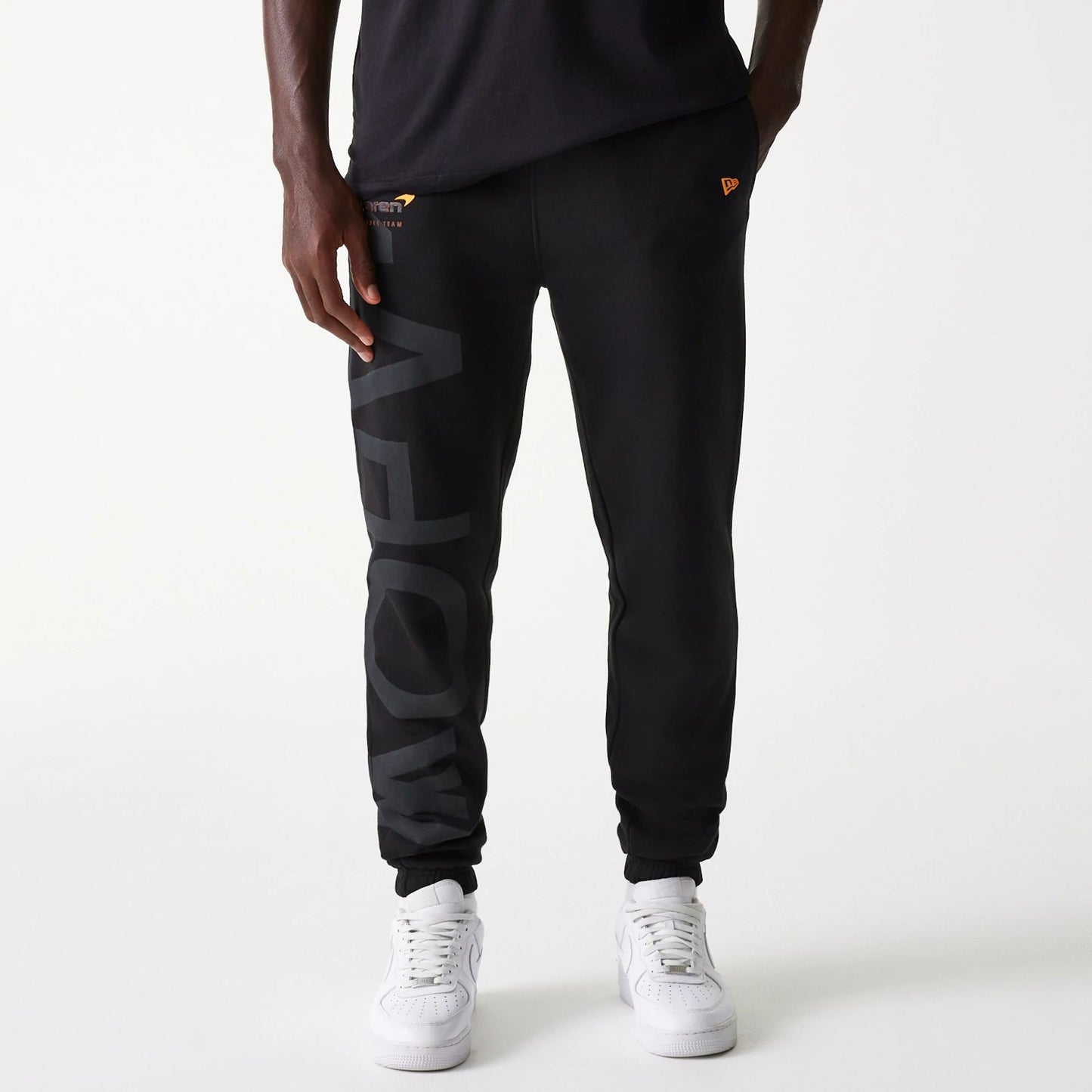 The Male model is wearing McLaren Racing Shadow Black Fleece Joggers 1