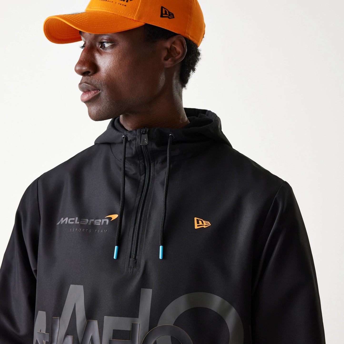 The Male model is wearing McLaren Racing Shadow Black Windbreaker Jacket 5