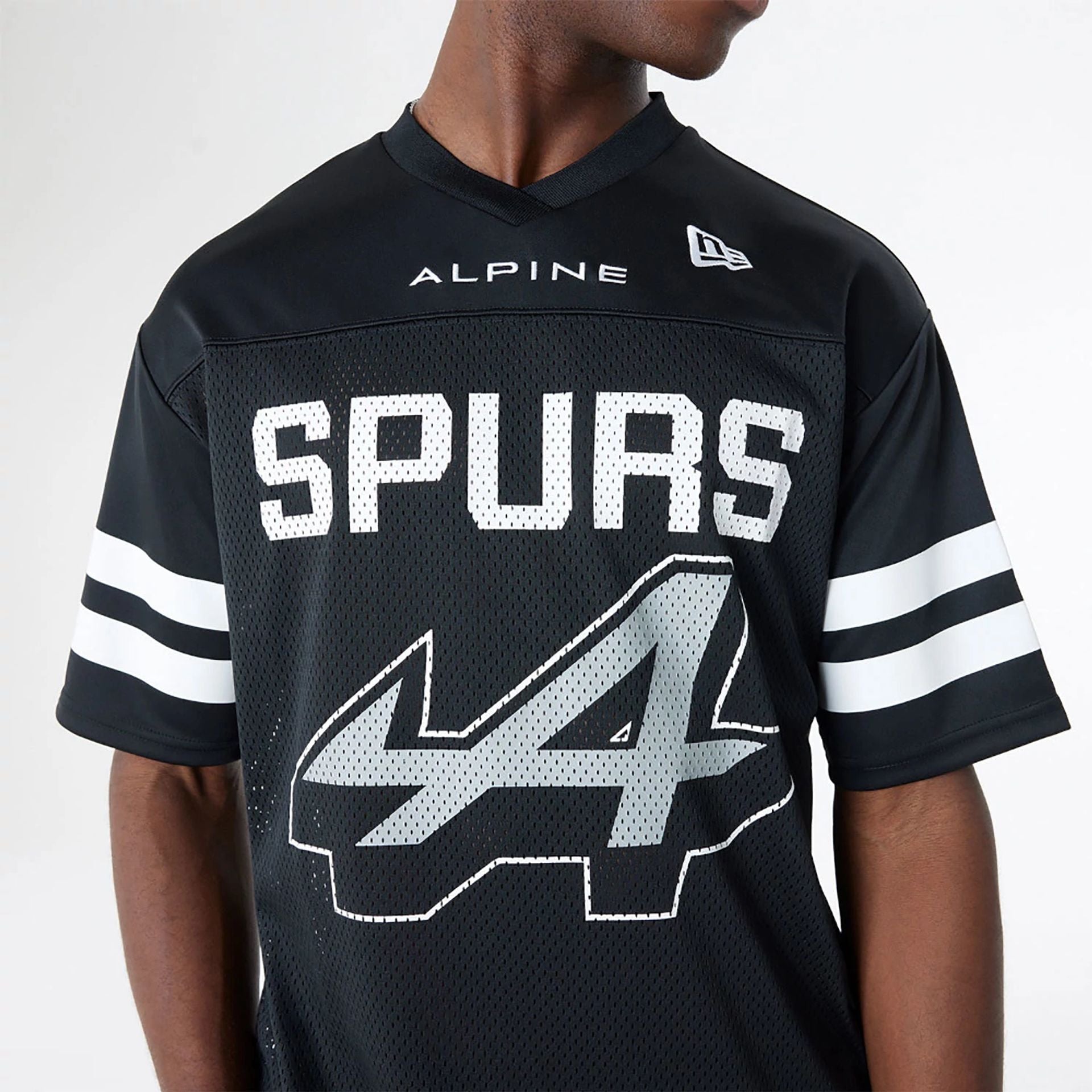 The Male model is wearing BTW Alpine F1 Racing x San Antonio Spurs Black Mesh T-Shirt 3