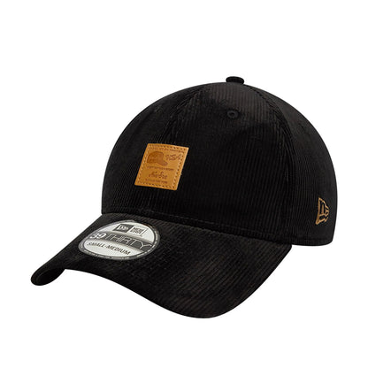 This is a New Era Cord Patch Black 39THIRTY Stretch-Fit Cap 1