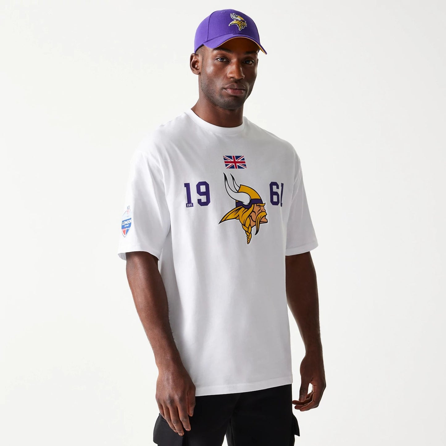 The Male model is wearing Minnesota Vikings NFL Games Square Arch White Oversized T-Shirt 1