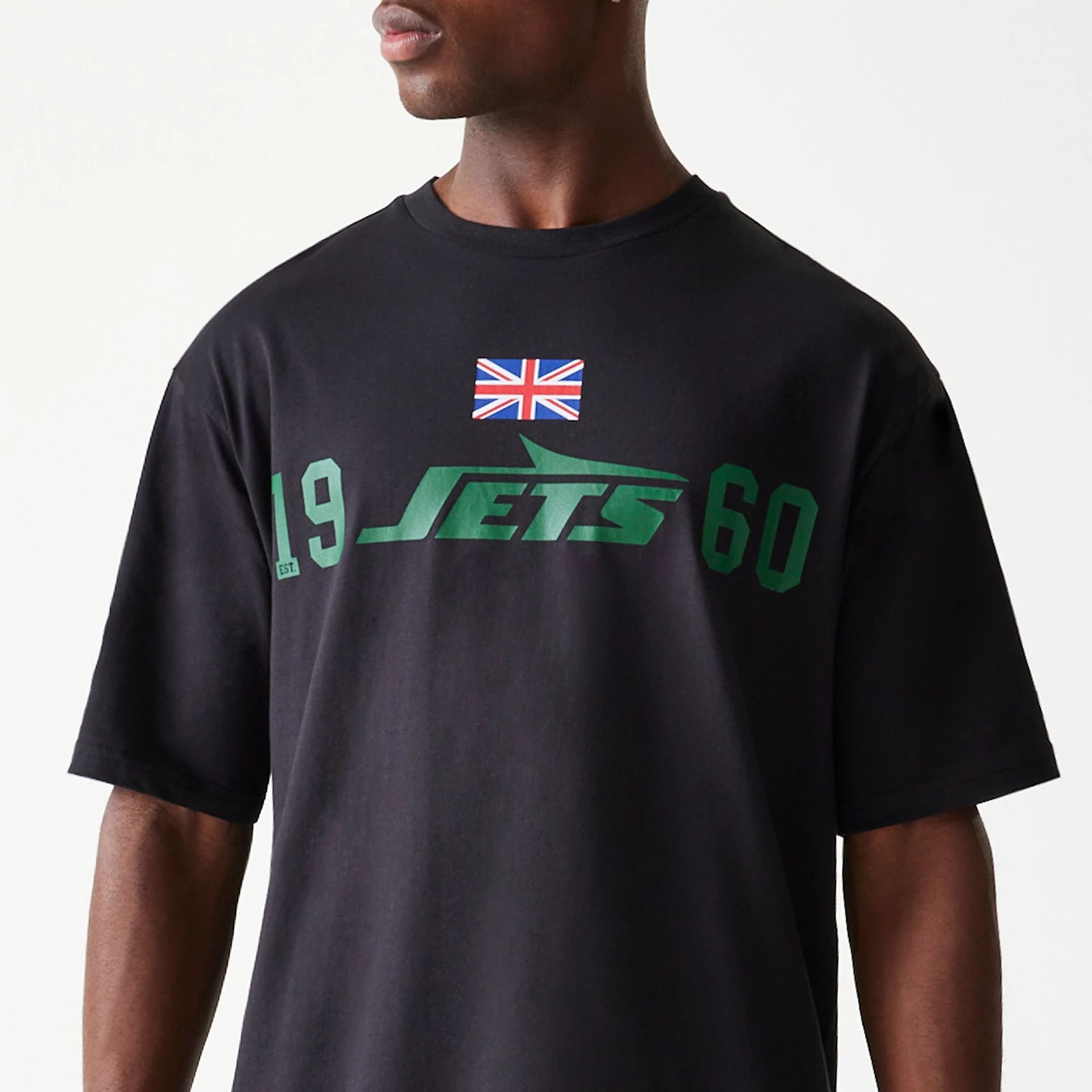 The Male model is wearing New York Jets NFL Games Square Arch Black Oversized T-Shirt 2