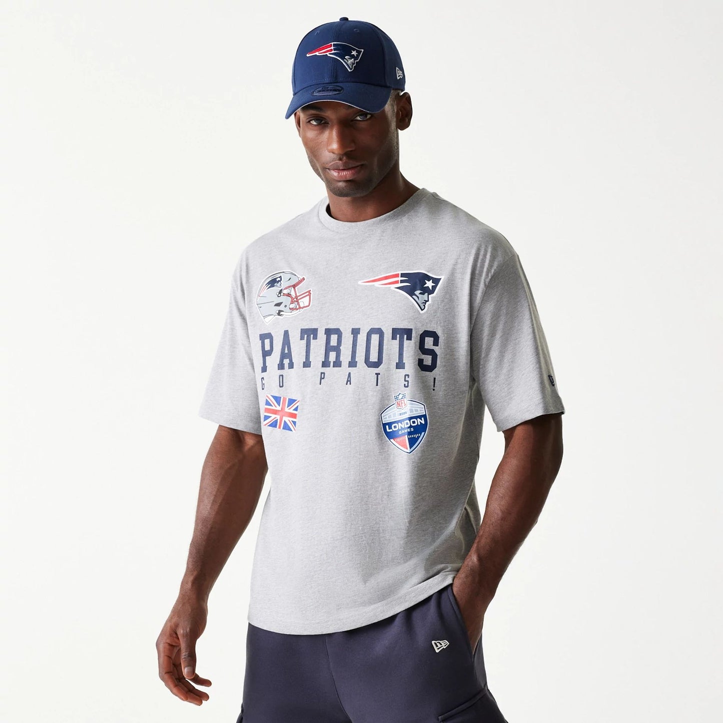 The Male model is wearing New England Patriots NFL Games Collegiate Grey Oversized T-Shirt 1