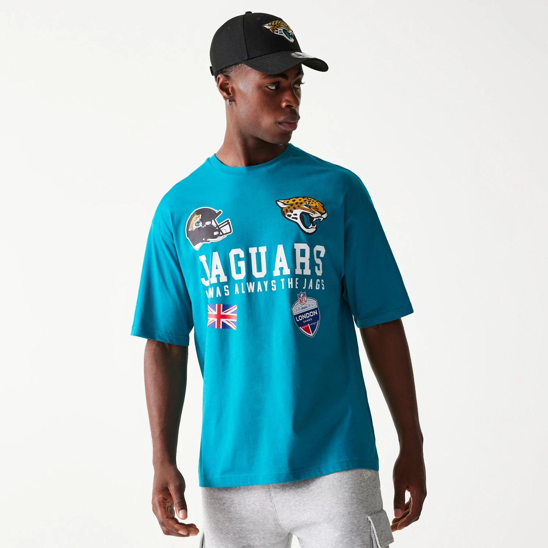 The Male model is wearing Jacksonville Jaguars NFL Games Collegiate Turquoise Oversized T-Shirt 1