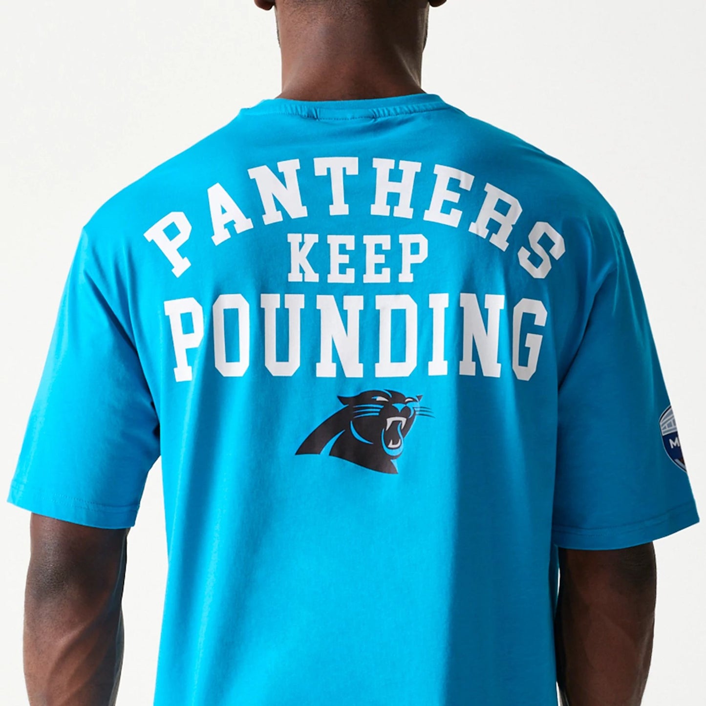 The Male model is wearing Carolina Panthers NFL Games Square Arch Bright Blue Oversized T-Shirt 6