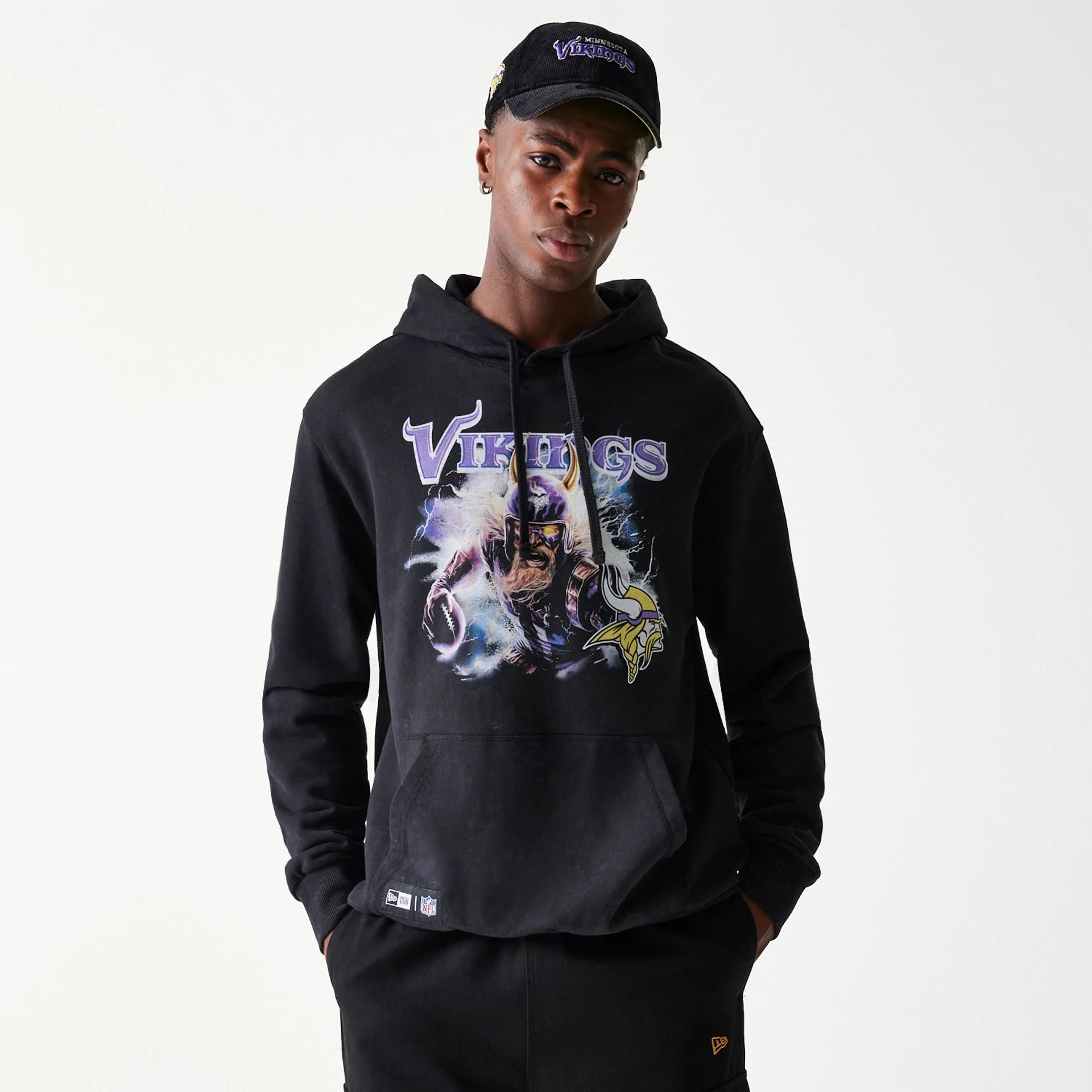 The Male model is wearing Minnesota Vikings NFL Games Premium Apparel Black Oversized Pullover Hoodie 1