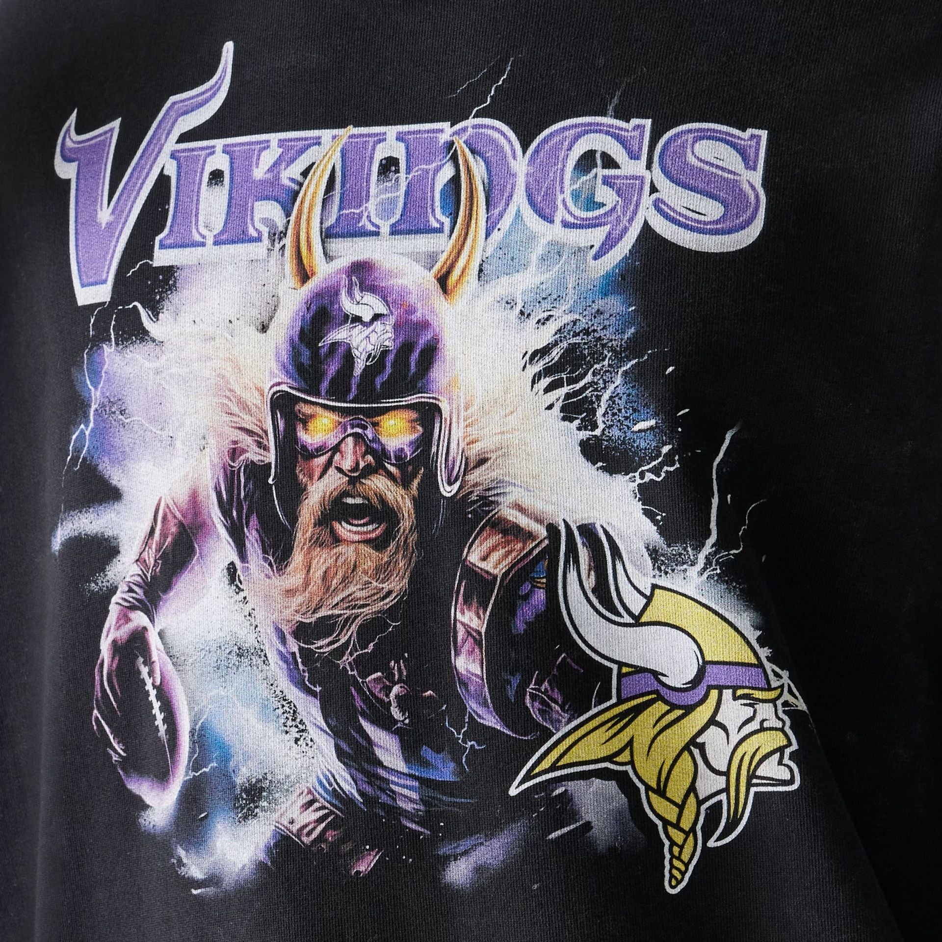 The Male model is wearing Minnesota Vikings NFL Games Premium Apparel Black Oversized Pullover Hoodie 5