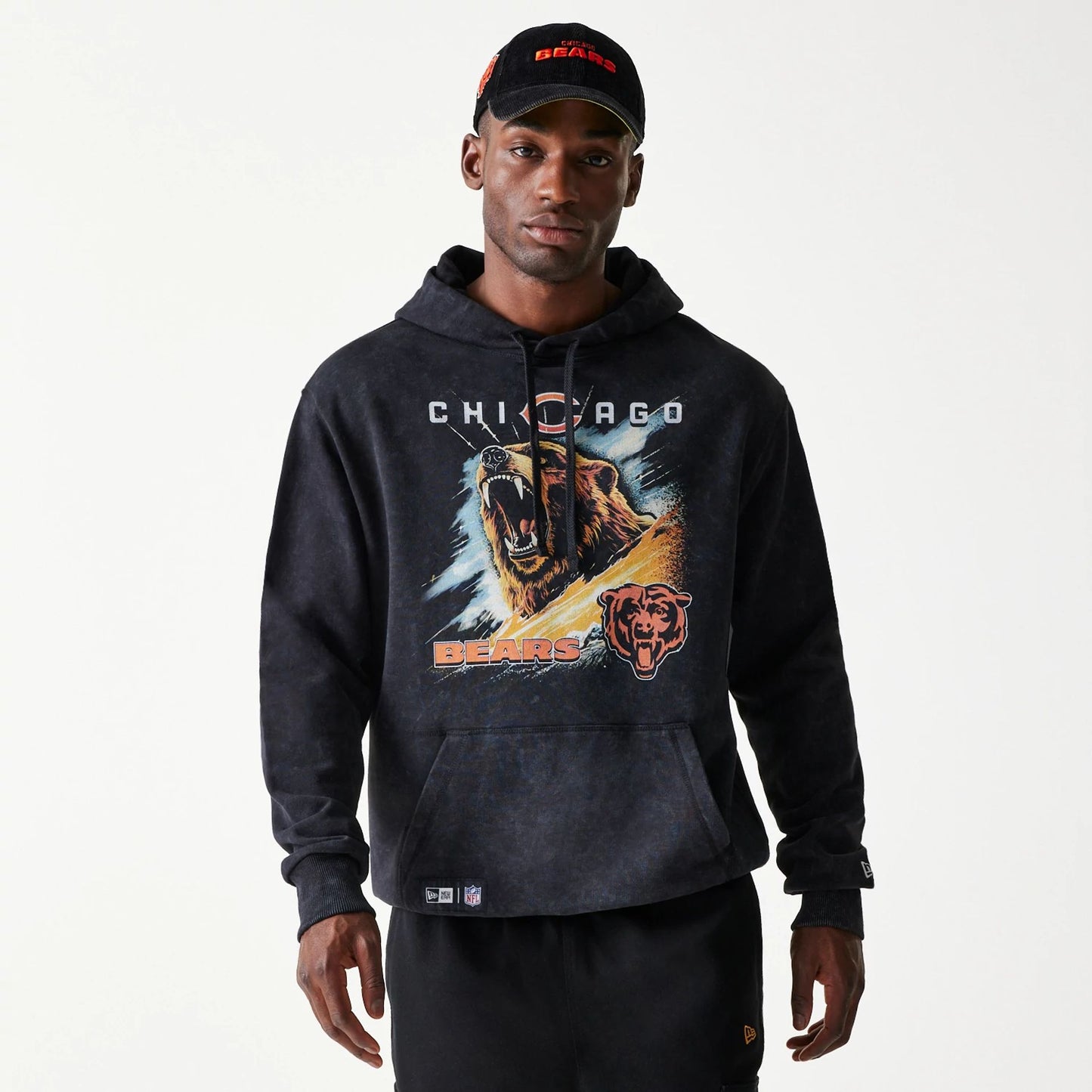 The Male model is wearing Chicago Bears NFL Games Premium Apparel Black Oversized Pullover Hoodie 1