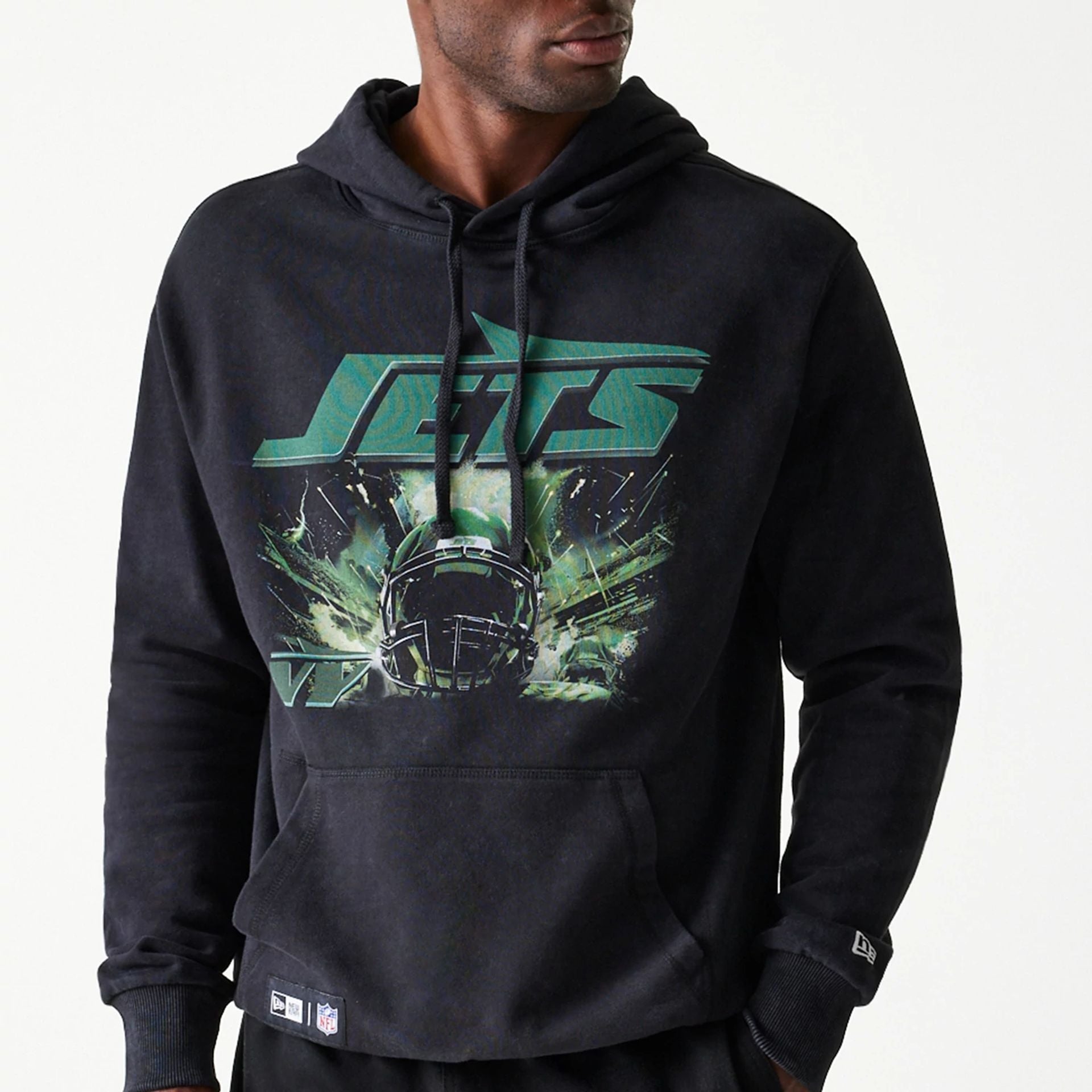 The Male model is wearing New York Jets NFL Games Premium Apparel Black Oversized Pullover Hoodie 2