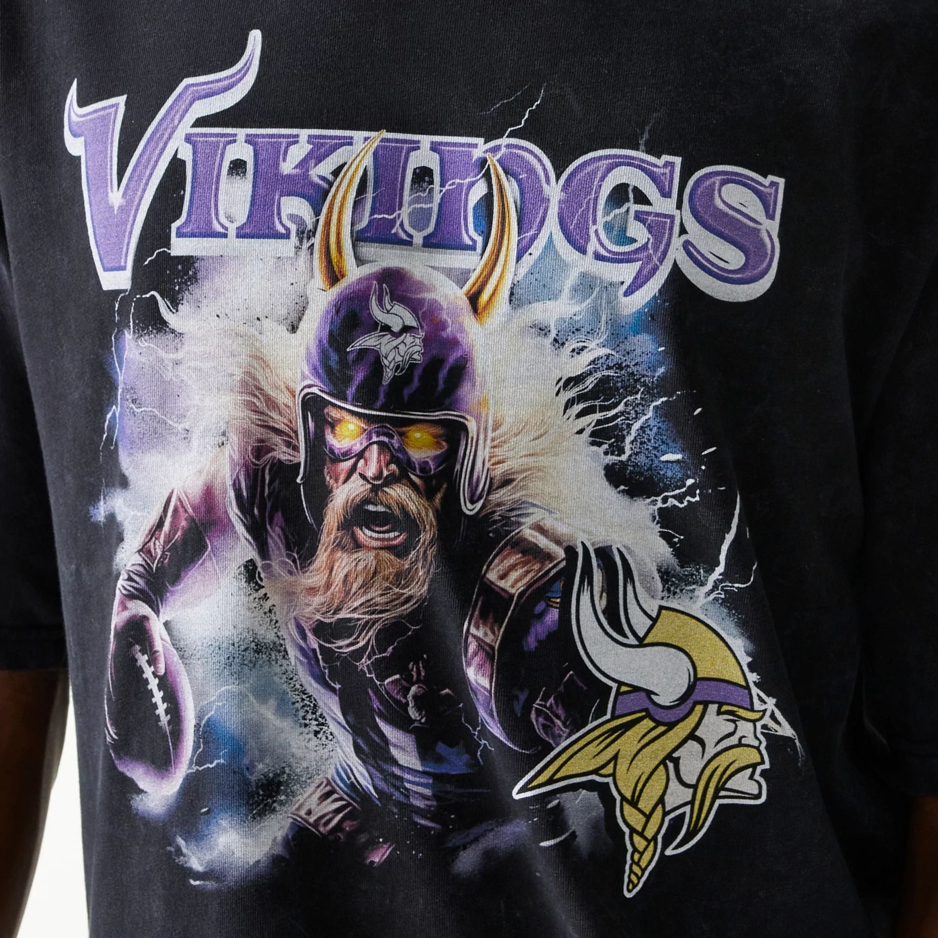 The Male model is wearing Minnesota Vikings NFL Games Premium Apparel Black Oversized T-Shirt 5