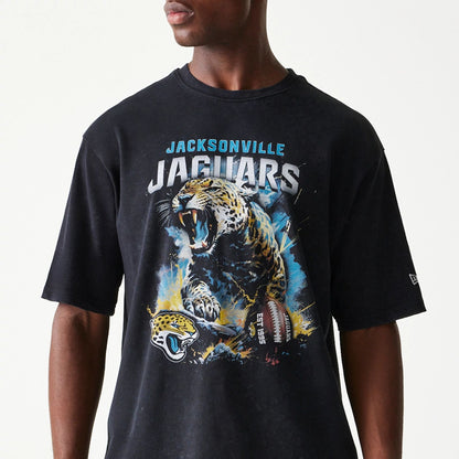 The Male model is wearing Jacksonville Jaguars NFL Games Premium Apparel Black Oversized T-Shirt 2