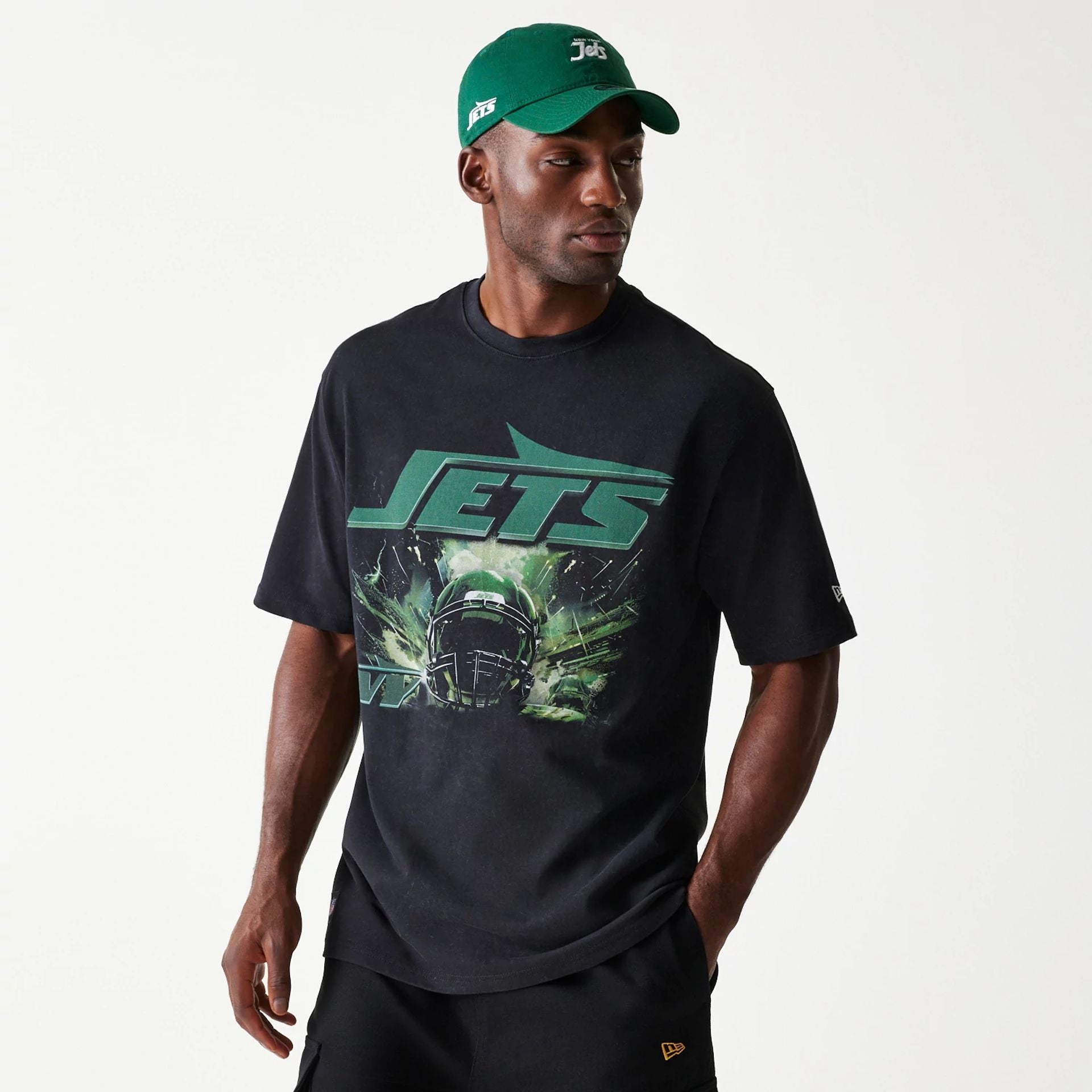 The Male model is wearing New York Jets NFL Games Premium Apparel Black Oversized T-Shirt 1