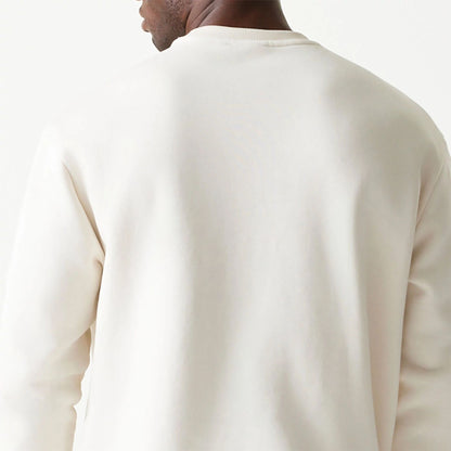 The Male model is wearing New Era Essential Brushed Fleece White Crewneck Sweater 7