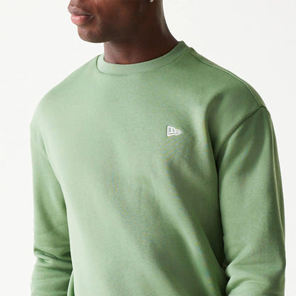 The Male model is wearing New Era Essential Brushed Fleece Green Crewneck Sweater 3