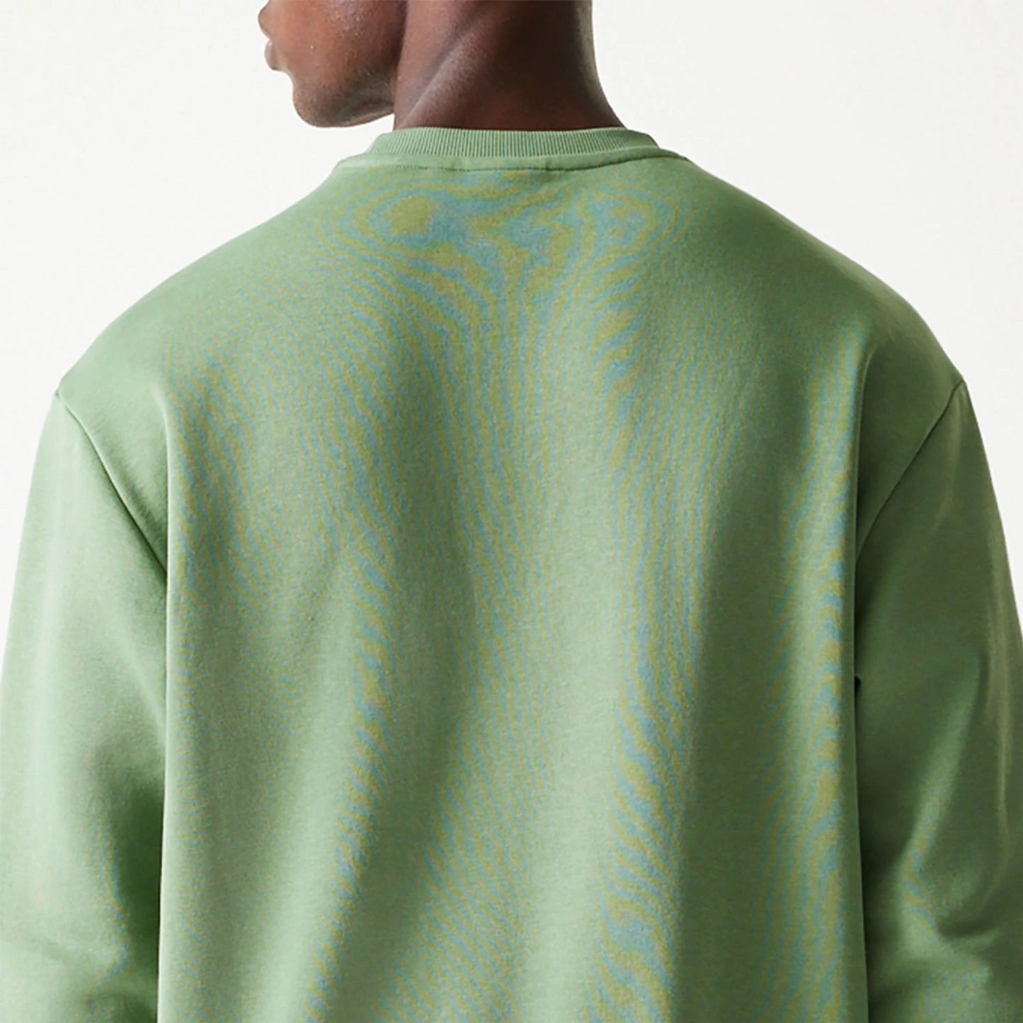 The Male model is wearing New Era Essential Brushed Fleece Green Crewneck Sweater 7