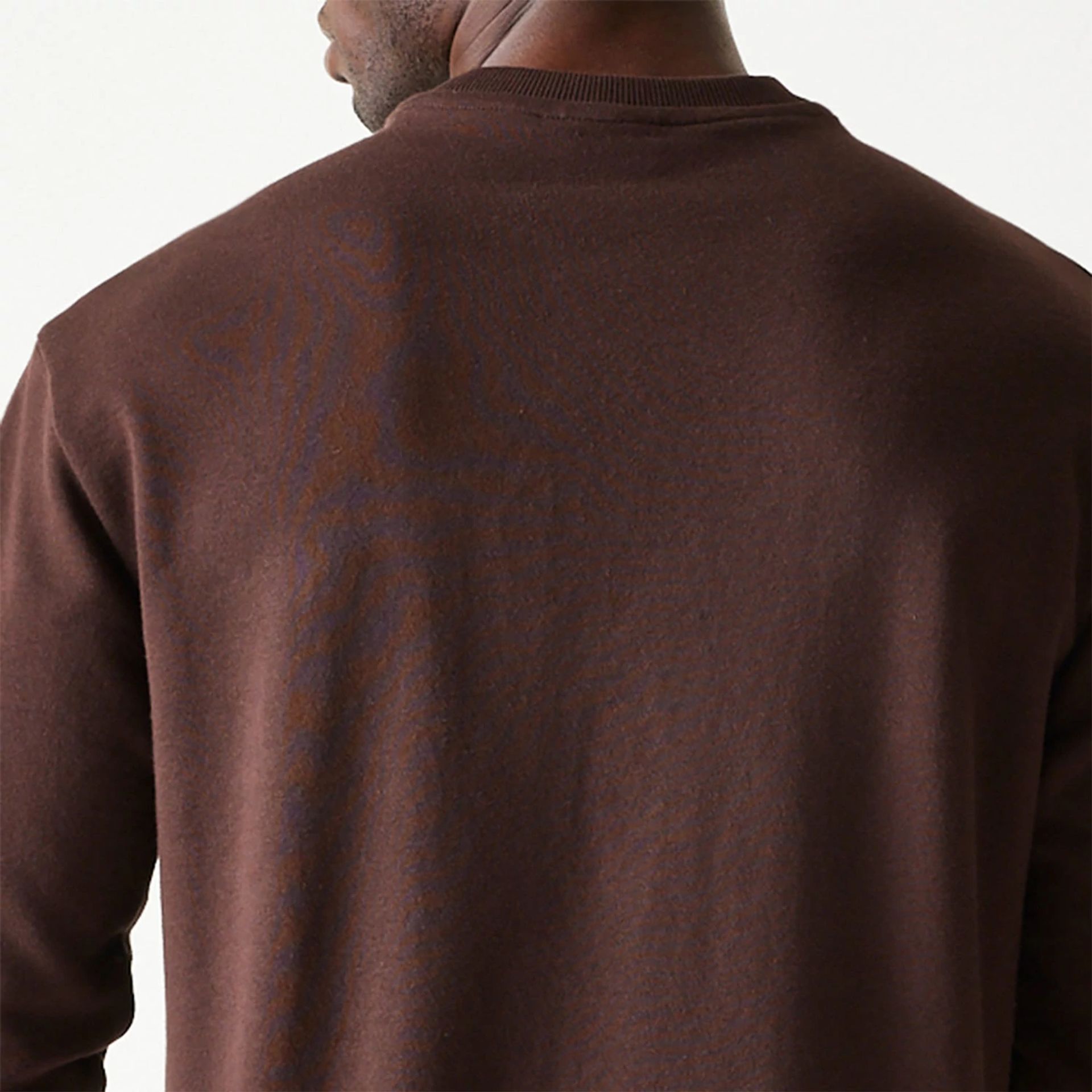 The Male model is wearing New Era Essential Dark Brown Crewneck Sweater 7