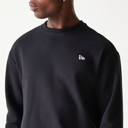 The Male model is wearing New Era Essential Black Crewneck Sweater 3