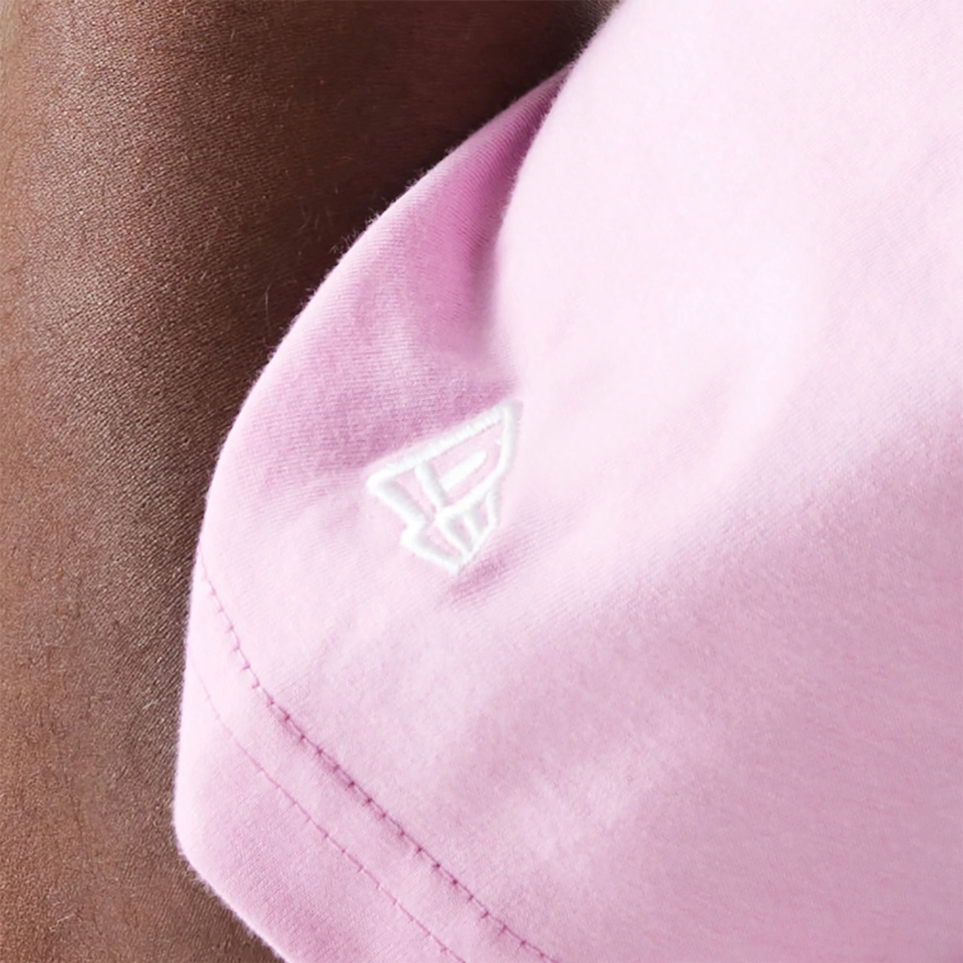 The Male model is wearing New Era Essential Pastel Pink Oversized T-Shirt 5