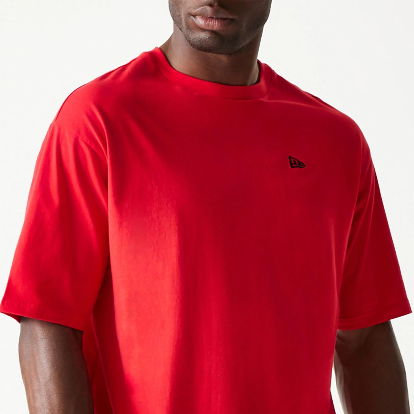 The Male model is wearing New Era Essential Red Oversized T-Shirt 3