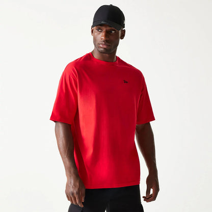 The Male model is wearing New Era Essential Red Oversized T-Shirt 1