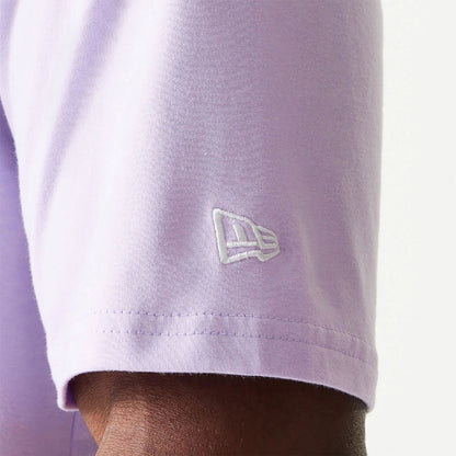 The Male model is wearing New Era Essential Pastel Purple Oversized T-Shirt 3