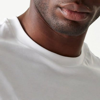 The Male model is wearing New Era Essential White Oversized T-Shirt 6