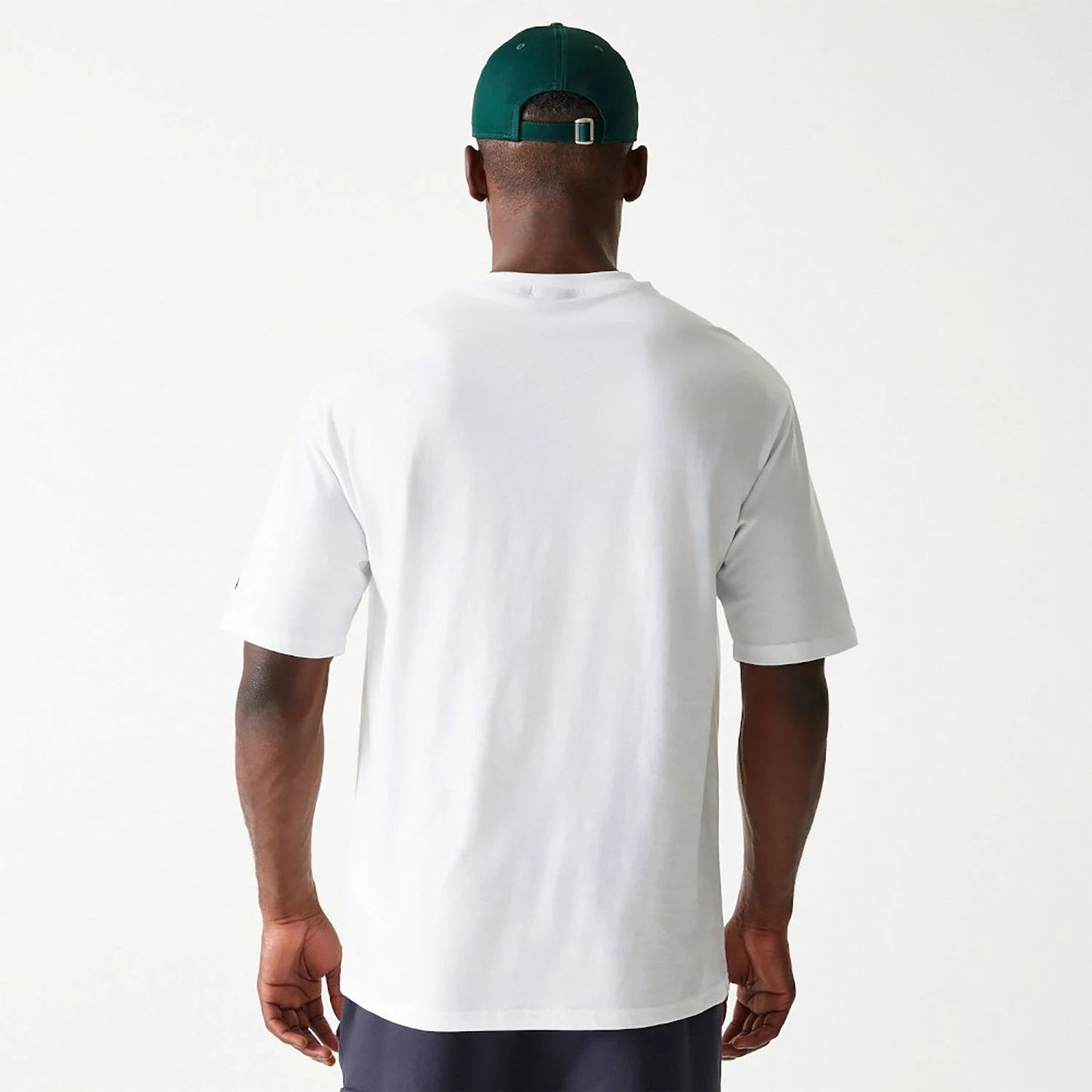 The Male model is wearing New Era Essential White Oversized T-Shirt 2