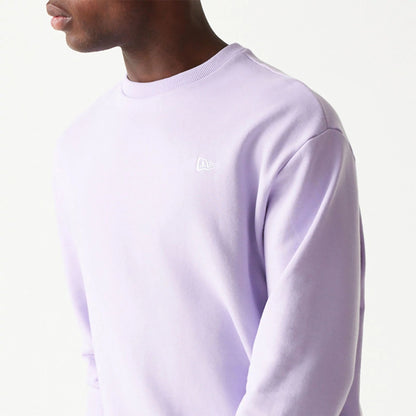 The Male model is wearing New Era Essential Pastel Purple Crewneck Sweater 3