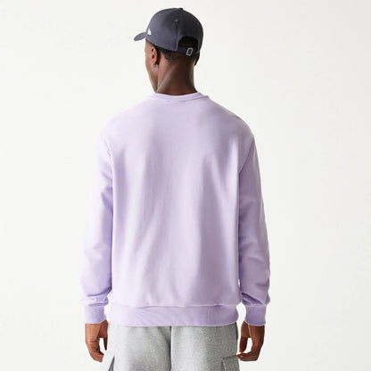 The Male model is wearing New Era Essential Pastel Purple Crewneck Sweater 2