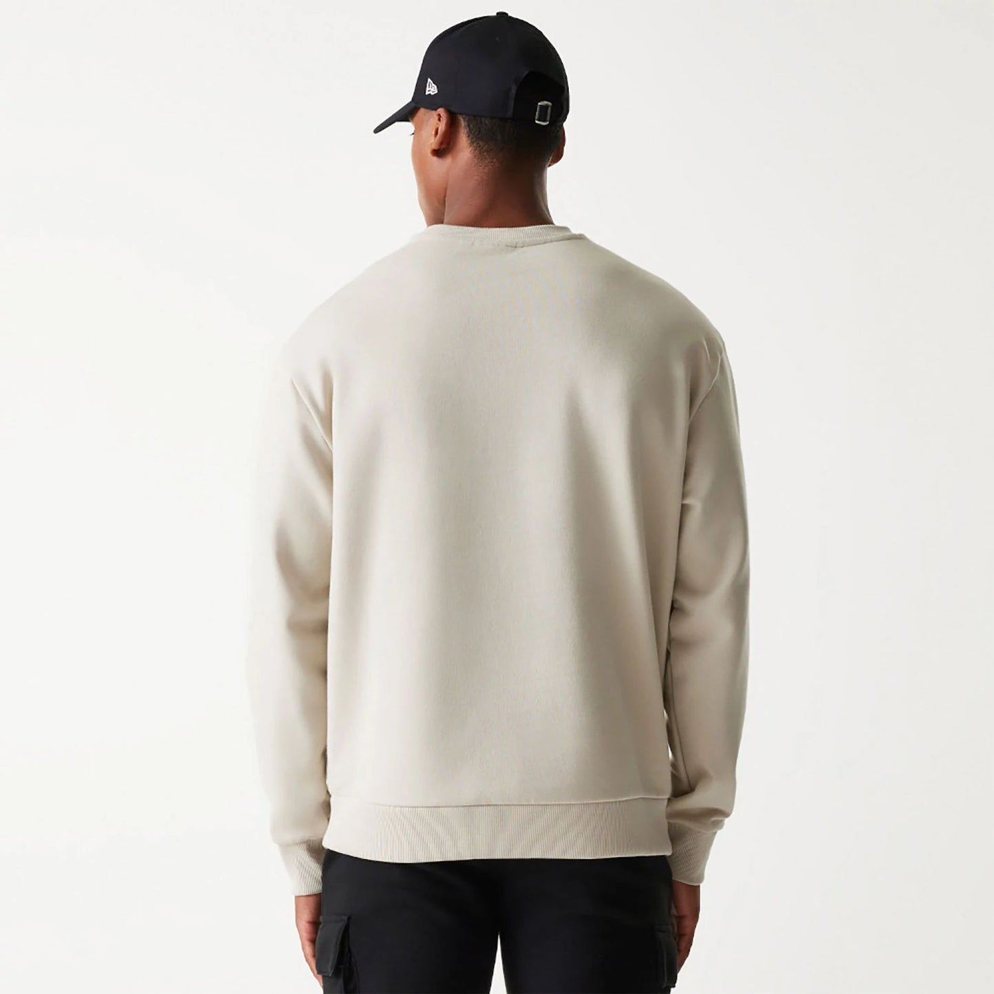 The Male model is wearing New Era Essential Brushed Fleece Light Beige Crewneck Sweater 2