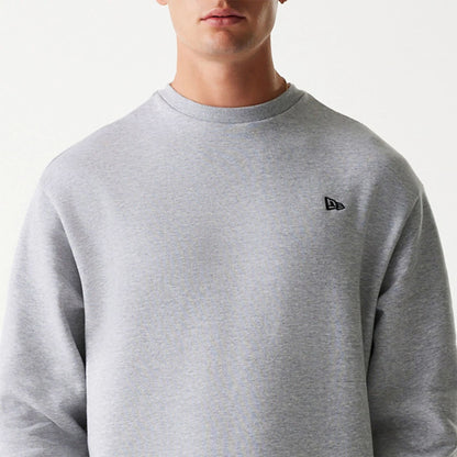 The Male model is wearing New Era Essential Brushed Fleece Grey Crewneck Sweater 3