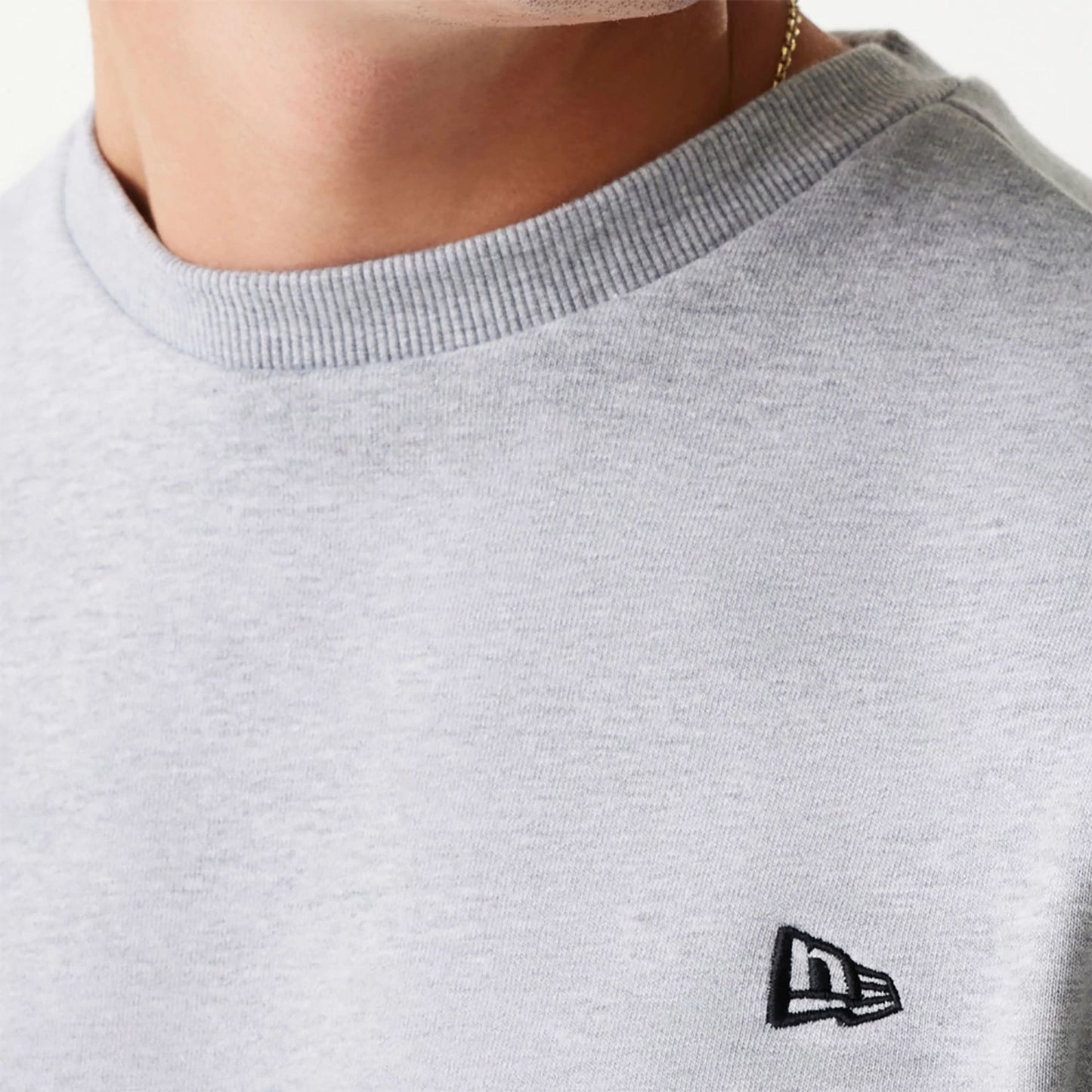 The Male model is wearing New Era Essential Brushed Fleece Grey Crewneck Sweater 6