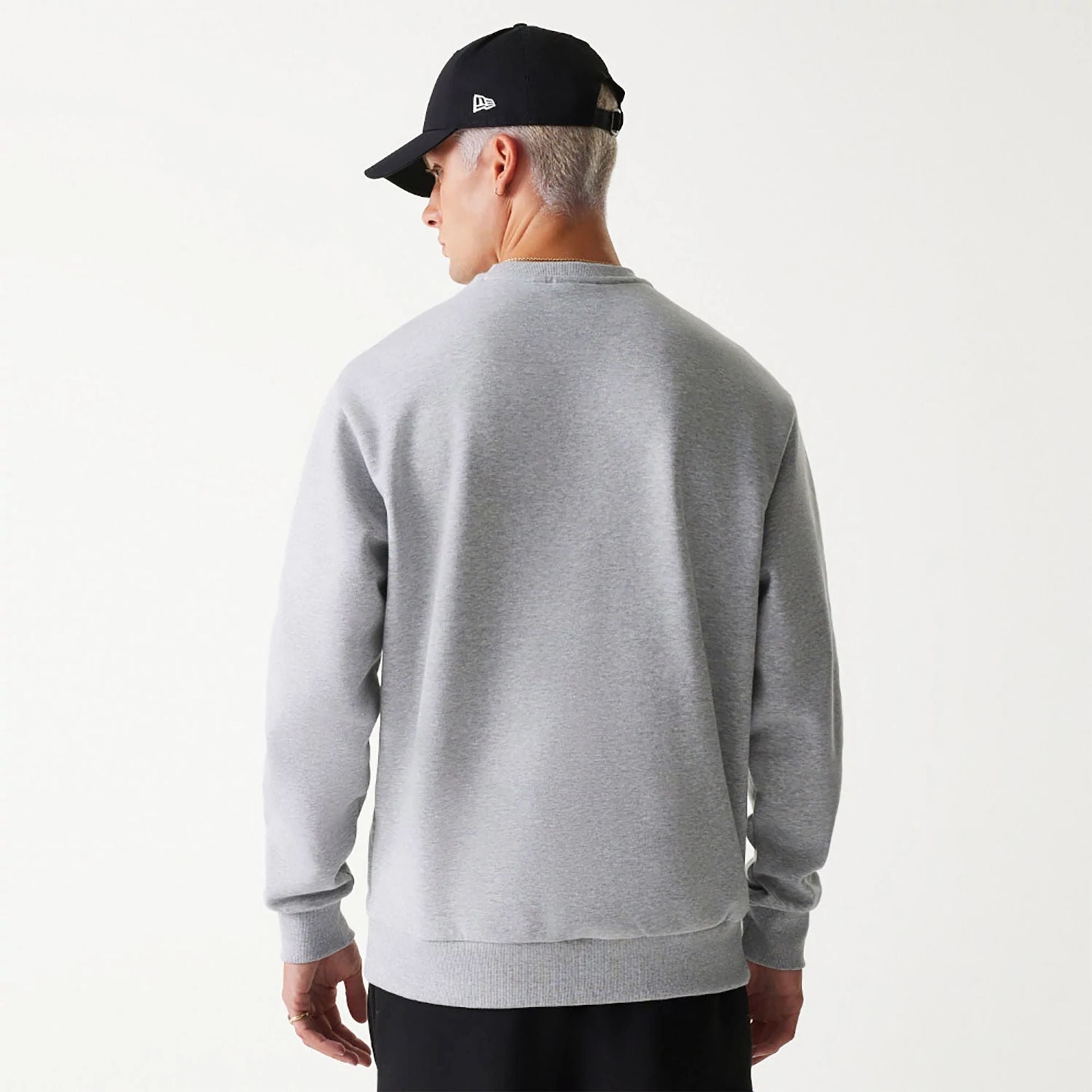 The Male model is wearing New Era Essential Brushed Fleece Grey Crewneck Sweater 2