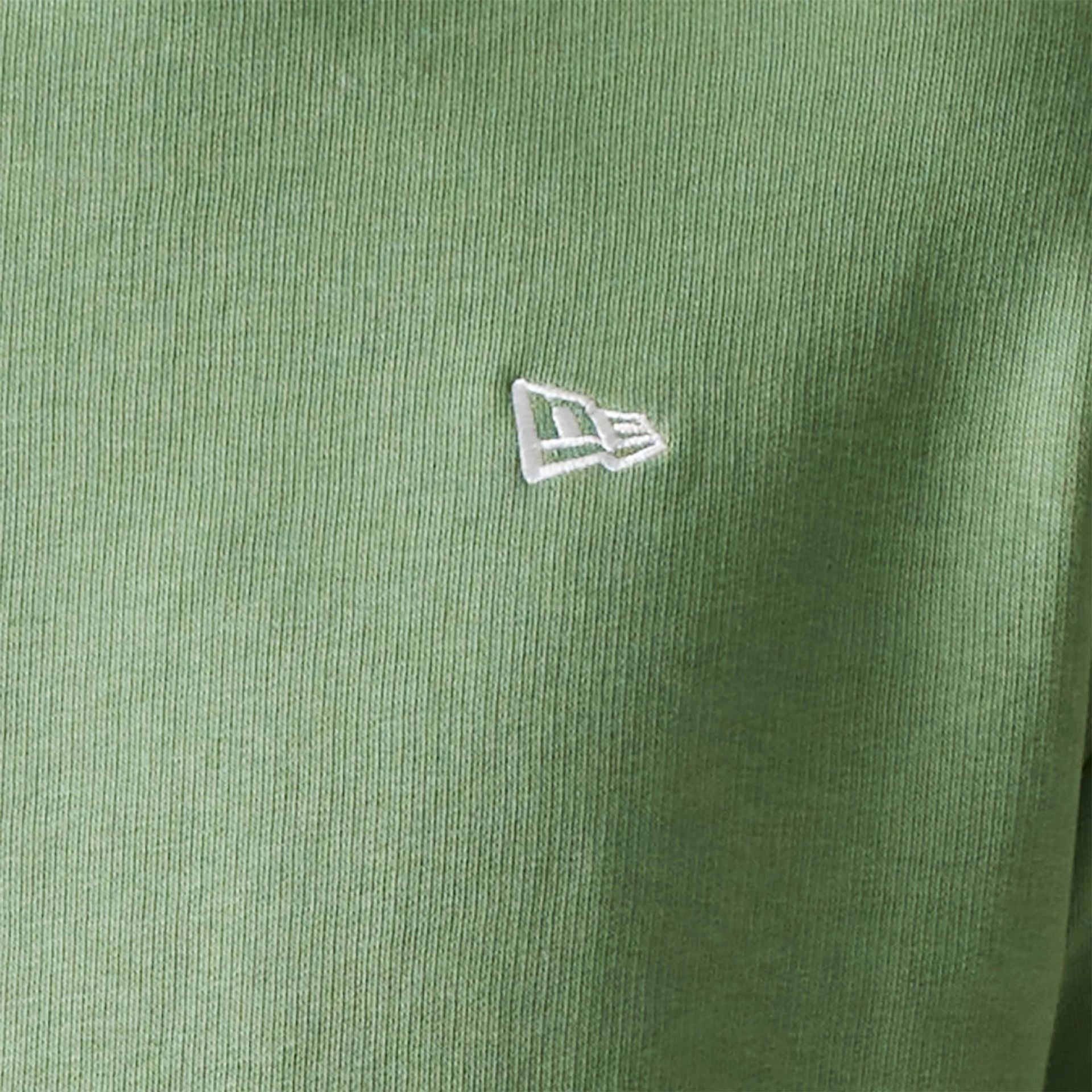 The Male model is wearing New Era Essential Pastel Green Oversized Crewneck Sweater 4