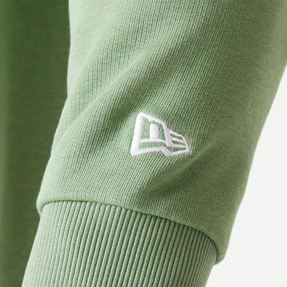 The Male model is wearing New Era Essential Pastel Green Oversized Crewneck Sweater 5