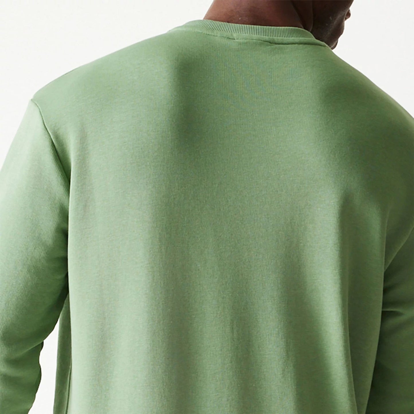 The Male model is wearing New Era Essential Pastel Green Oversized Crewneck Sweater 7