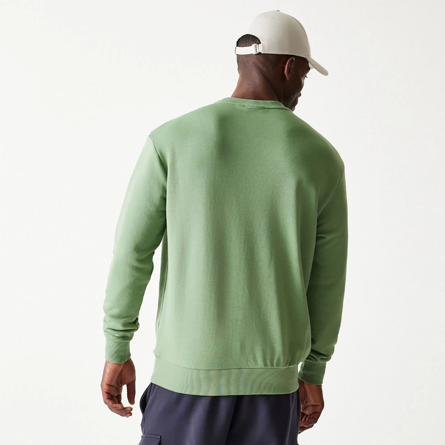 The Male model is wearing New Era Essential Pastel Green Oversized Crewneck Sweater 2