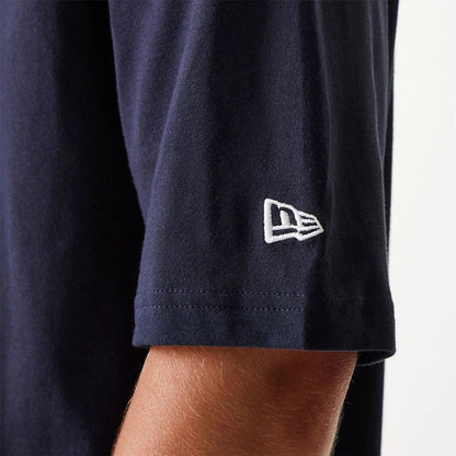 The Male model is wearing New Era Essential Navy Oversized T-Shirt 5