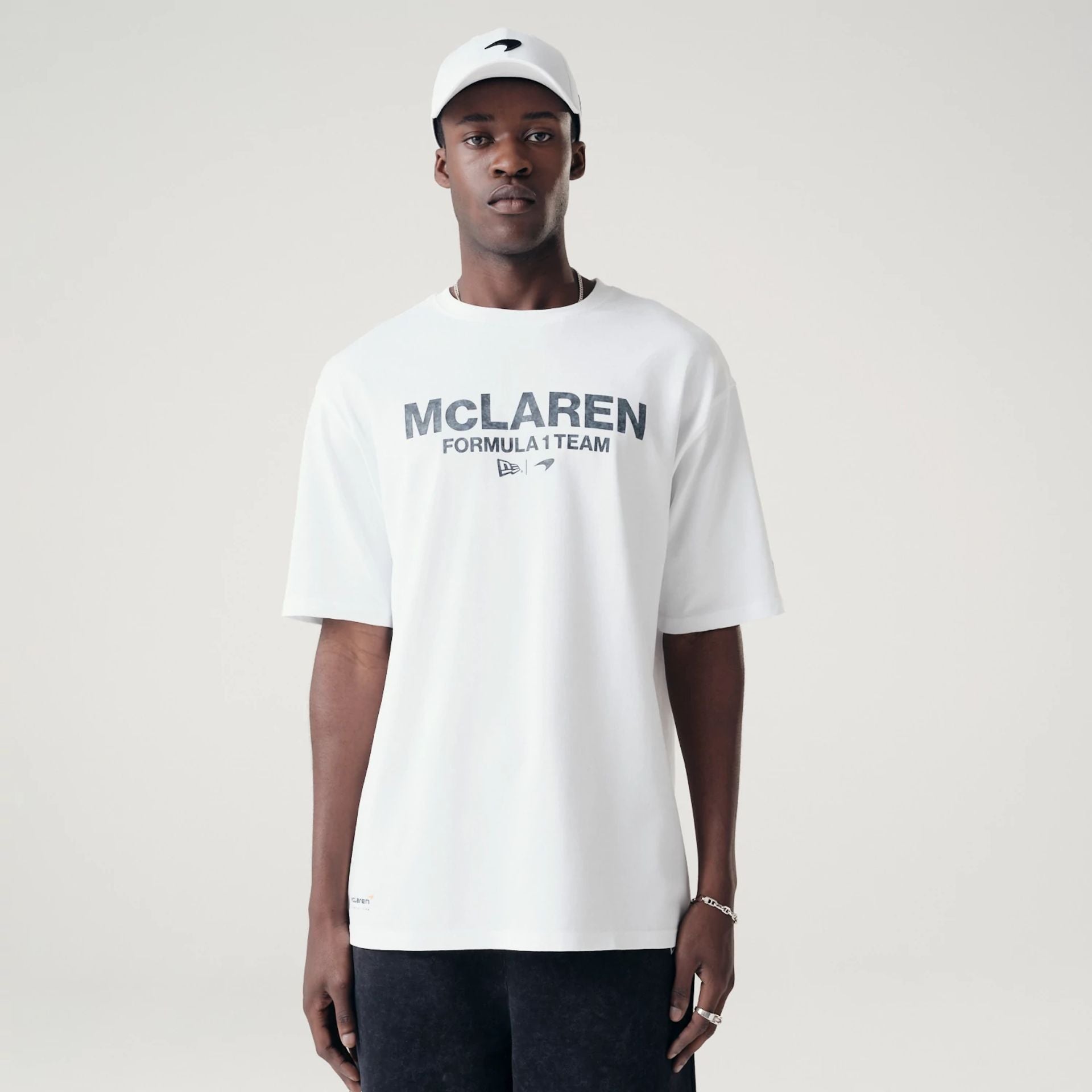 The Male model is wearing McLaren Racing Washed Pack White Oversized T-Shirt 1