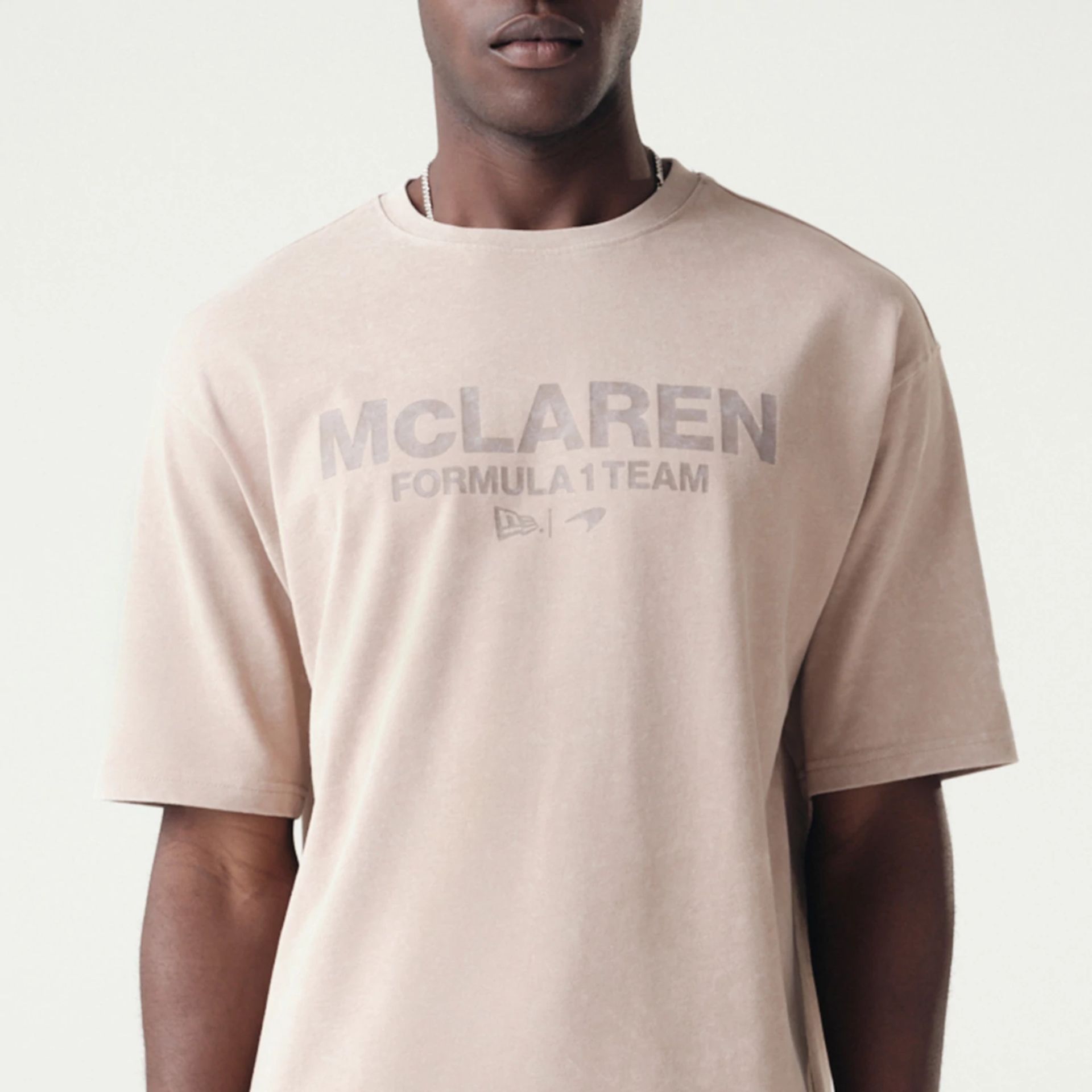 The Male model is wearing McLaren Racing Washed Pack Beige Oversized T-Shirt 3