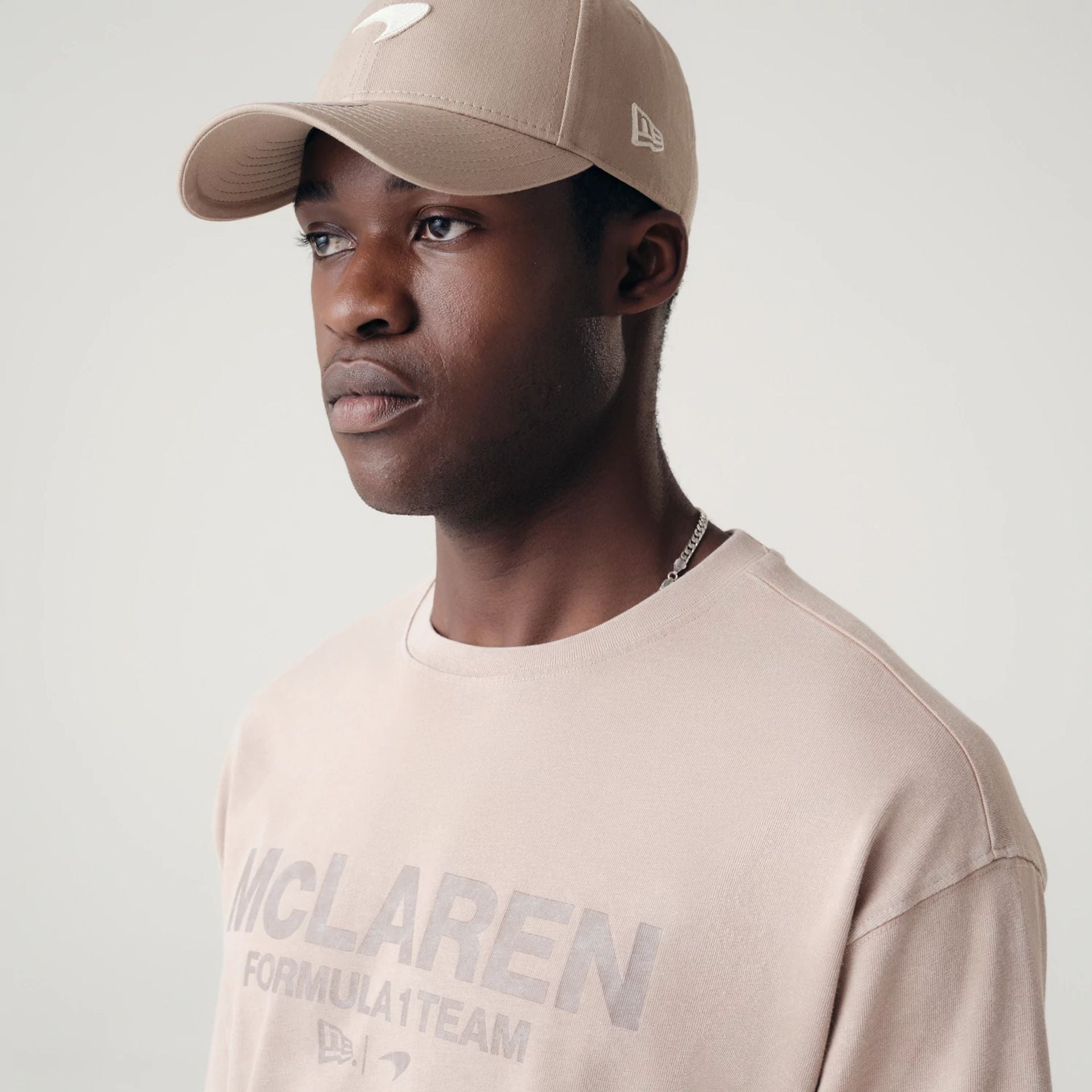 The Male model is wearing McLaren Racing Washed Pack Beige Oversized T-Shirt 4