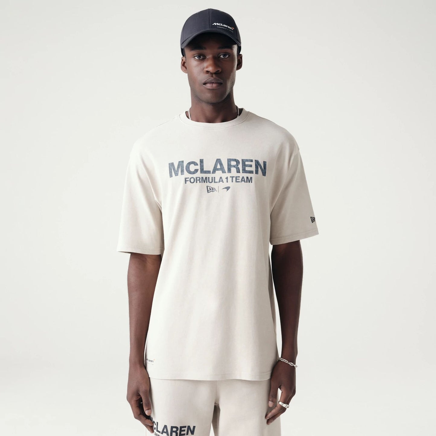 The Male model is wearing McLaren Racing Washed Pack Cream Oversized T-Shirt 1